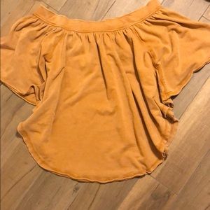 Camel color poncho wide of the shoulder neck.